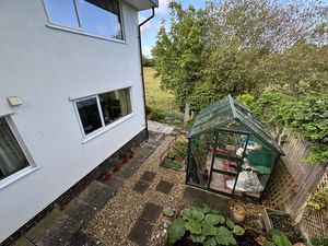GREENHOUSE FROM KITCHEN ENRANCE WAY- click for photo gallery
